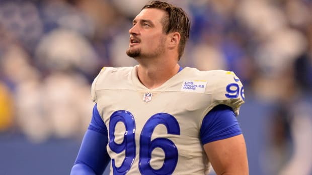 Michael Hoecht walks across the field before a Rams game against the Giants